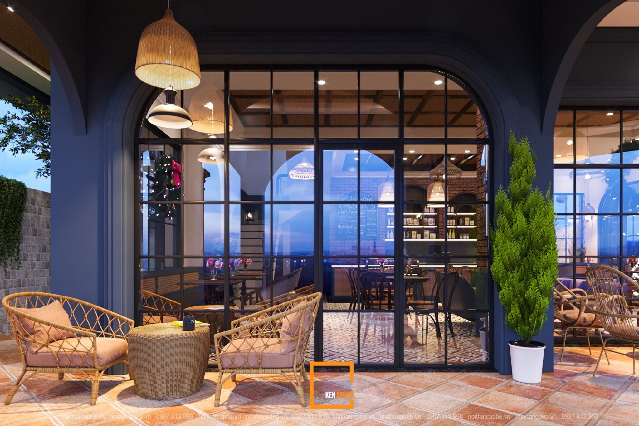 khu hiên quán cafe góc phố với ghế mây và cửa kính khung đen vòm cuốn